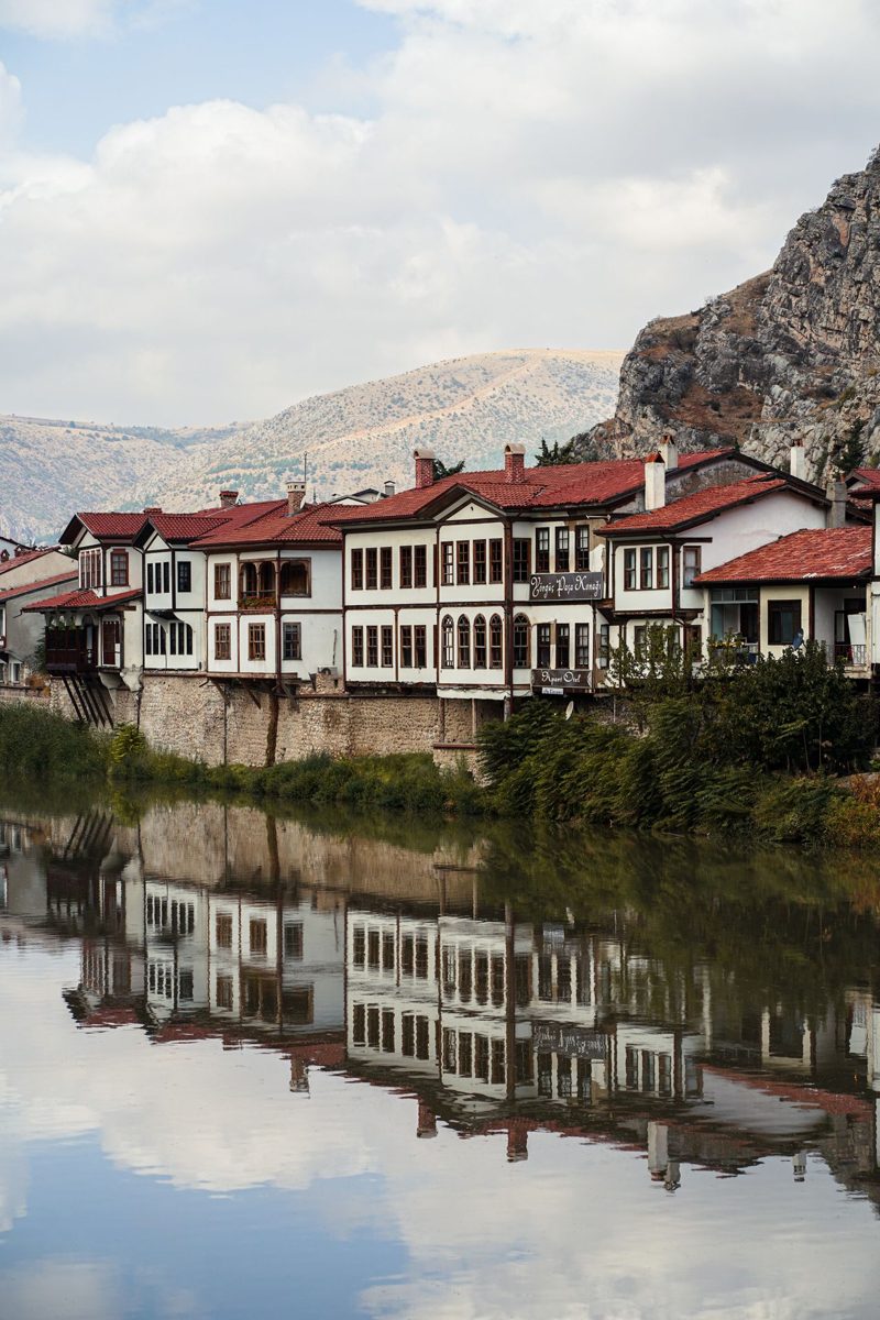 Ottoman houses reflected in the Yesilirmak River at Amasya, Turkey