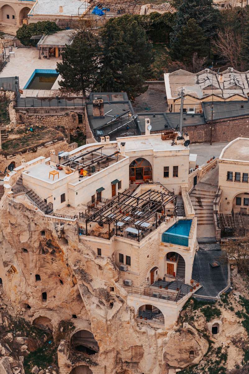 Aerial view of a cave hotel among the rock formations of Cappadocia