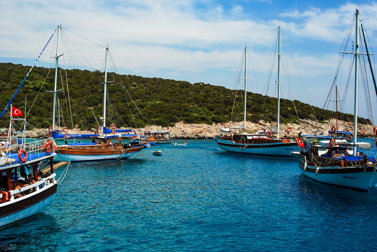 Gulet boats anchored in a turquoise Aegean bay on the Datça Peninsula, Turkey