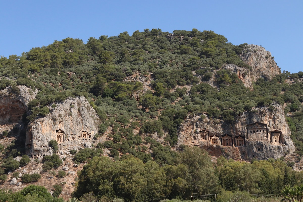 Lycian rock tombs carved into a rocky hillside above the Dalyan river, Muğla, Turkey