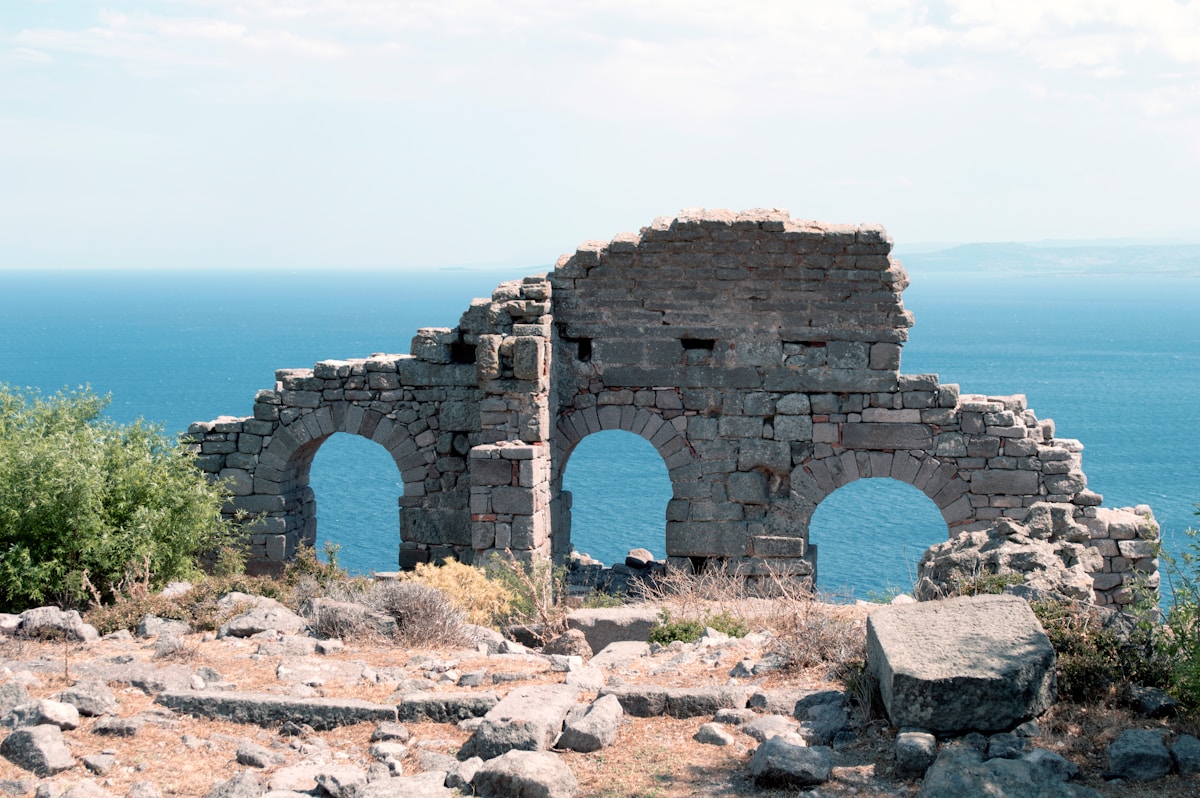 Ancient stone ruins with arched walls overlooking the Aegean sea near Knidos, Datça Peninsula, Turkey