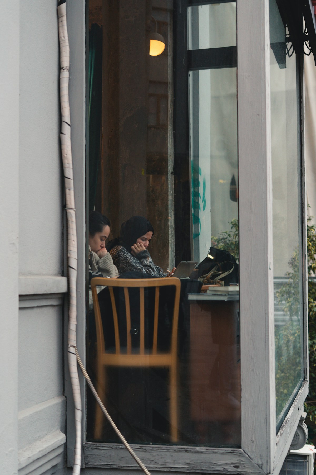Two people working on laptops at a café in Istanbul, Turkey