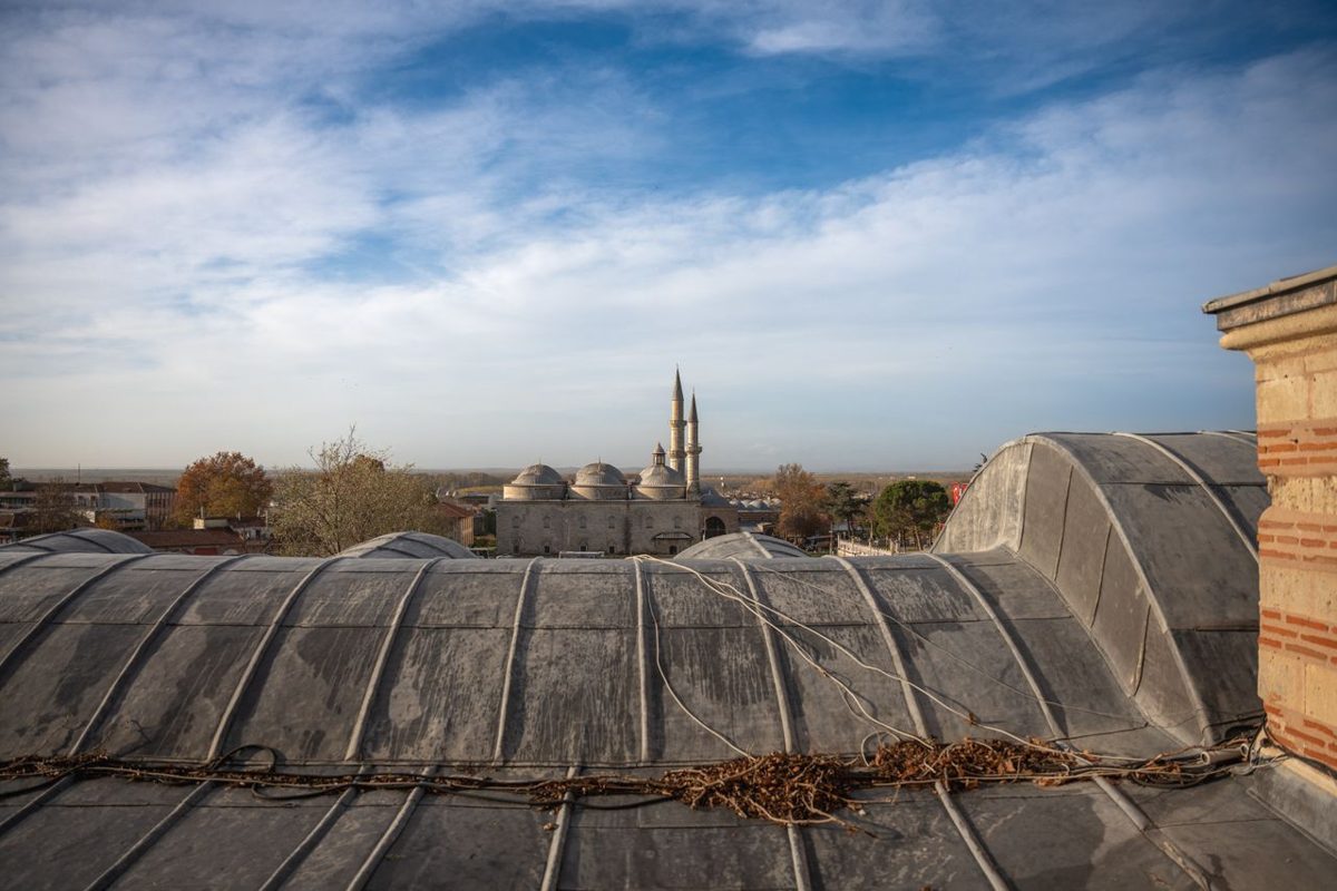 Traditional rooftops and minarets in Edirne under a clear blue sky