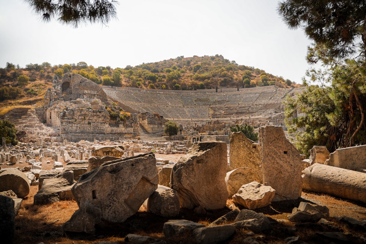 Visitors exploring ancient Roman ruins at Ephesus archaeological site, Turkey