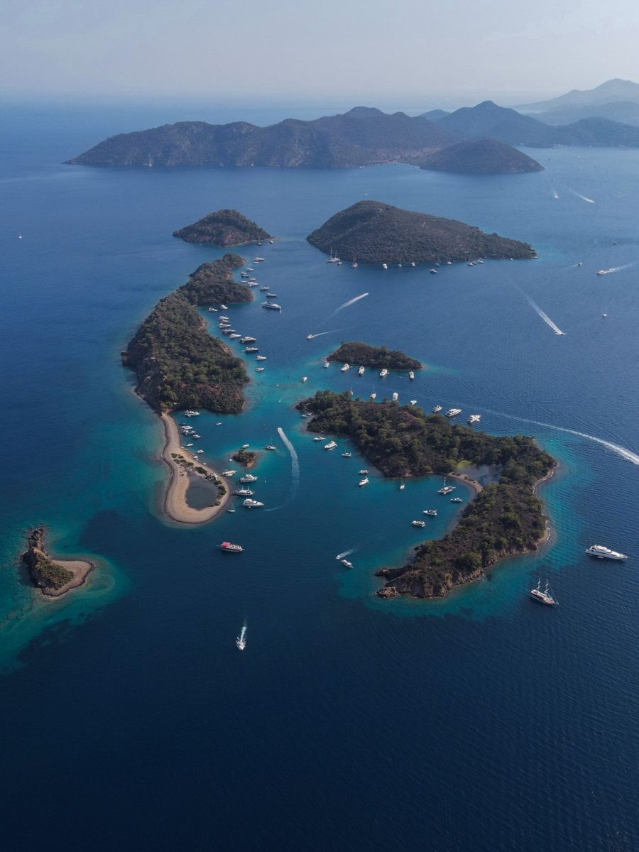 Aerial view of the Gocek islands with anchored boats in blue water