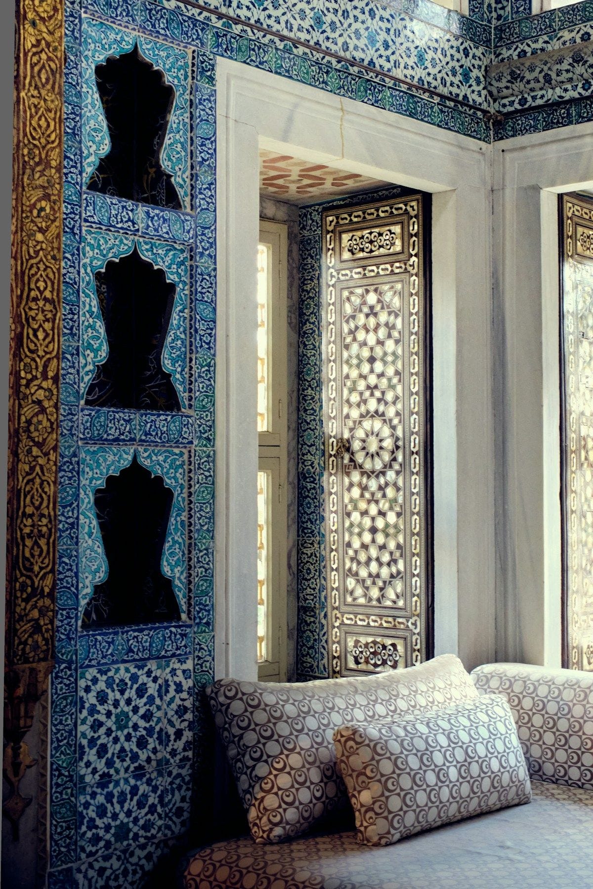 Ornate Iznik tilework and inlaid Ottoman door inside Topkapi Palace, Istanbul - the craftsmanship that defines the hammam tradition