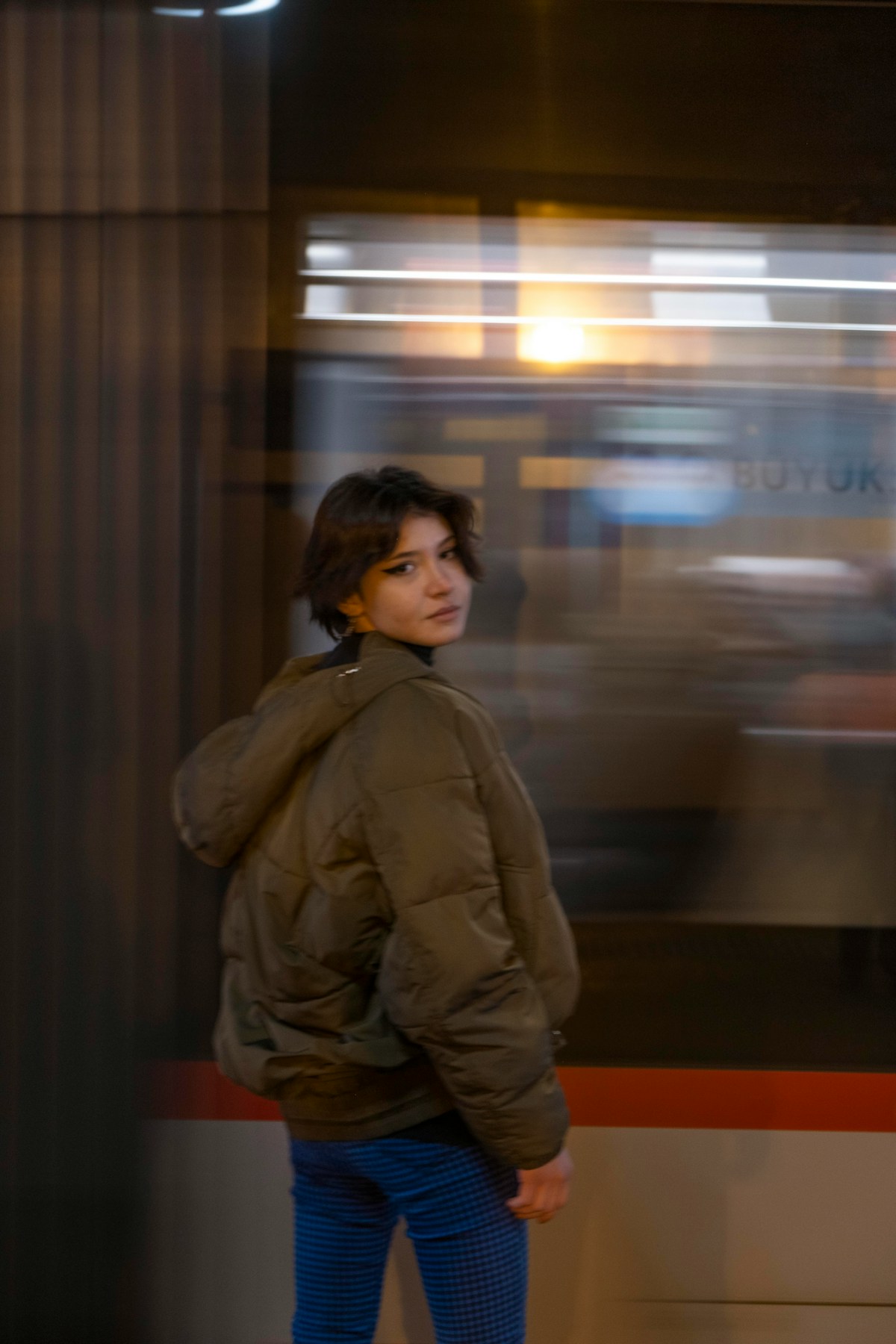 Woman waiting at a Turkish train station - travelling from Istanbul to Cappadocia via Kayseri
