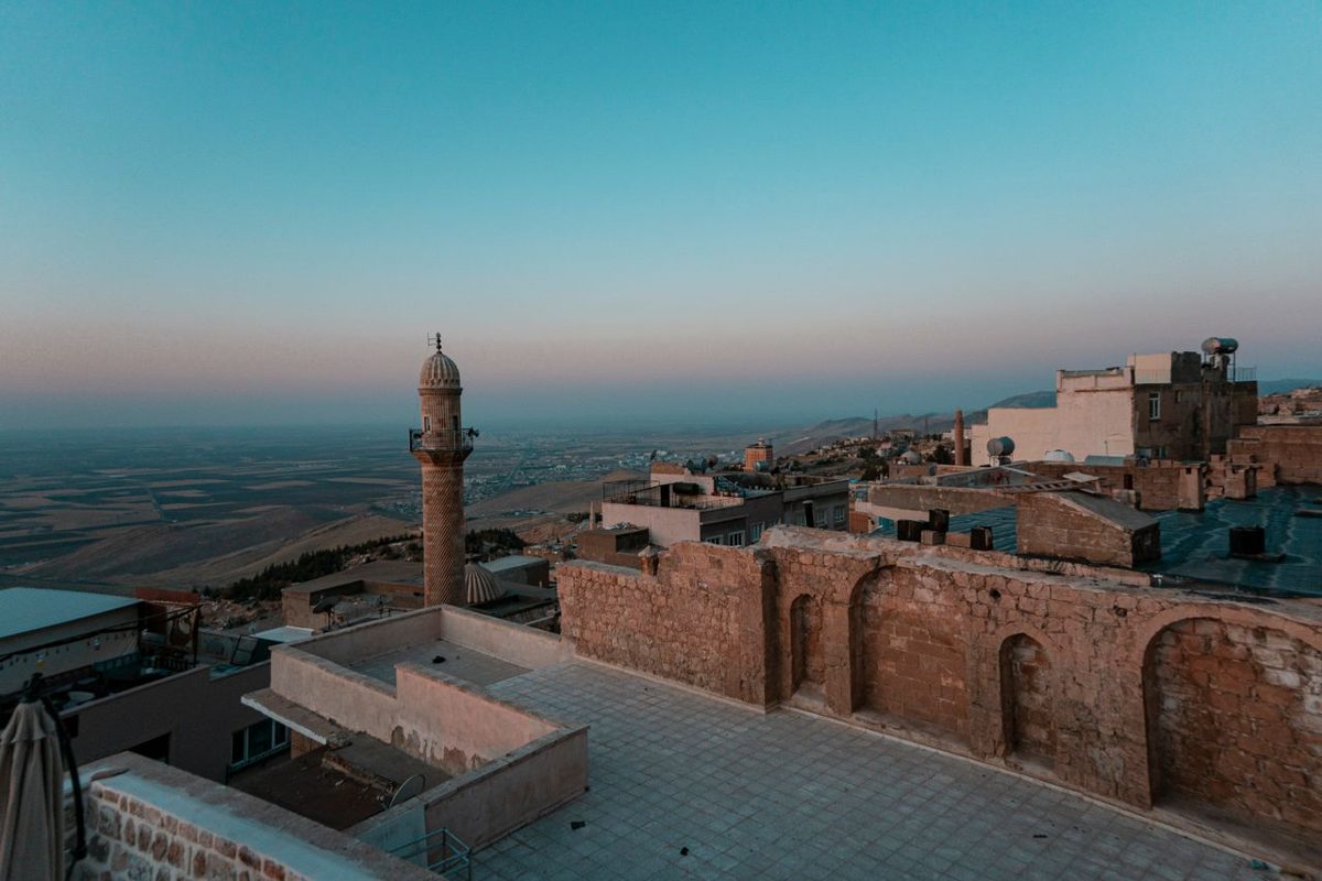 Misty dawn over Mardin's ancient skyline and minarets