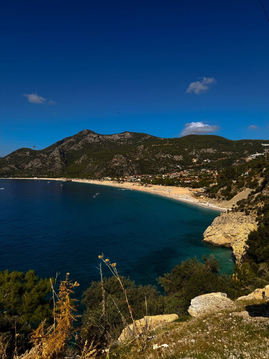 Blue Lagoon beach ringed by green mountains at Oludeniz