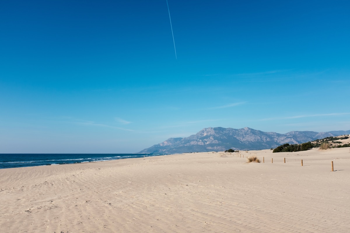 Wide sandy beach at Patara with sea and Akdağ mountains in the background, Lycian Coast, Turkey