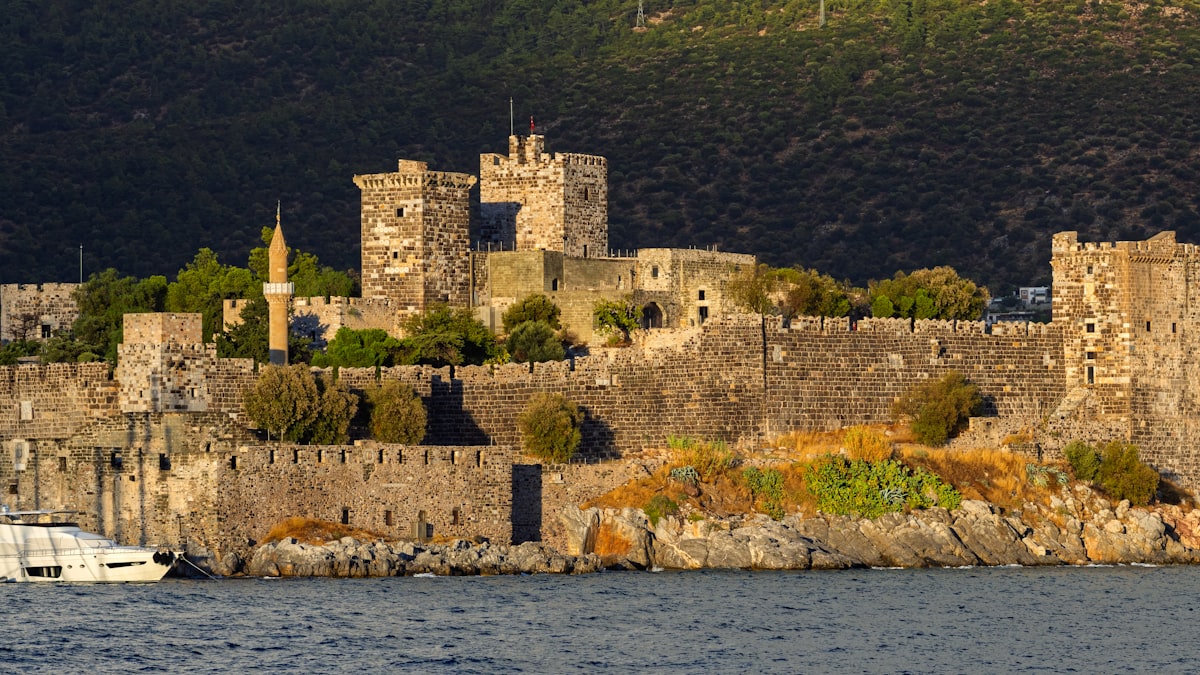 Bodrum Castle (St Peter's Castle) rising above the harbour at golden hour, Muğla province, Turkey