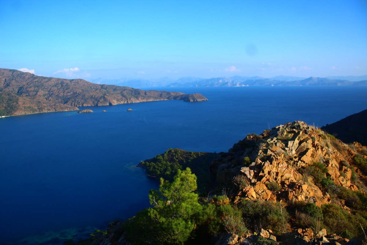 Scenic coastal landscape with turquoise water and rocky hills in Muğla, Türkiye - Dalaman region on the Aegean coast