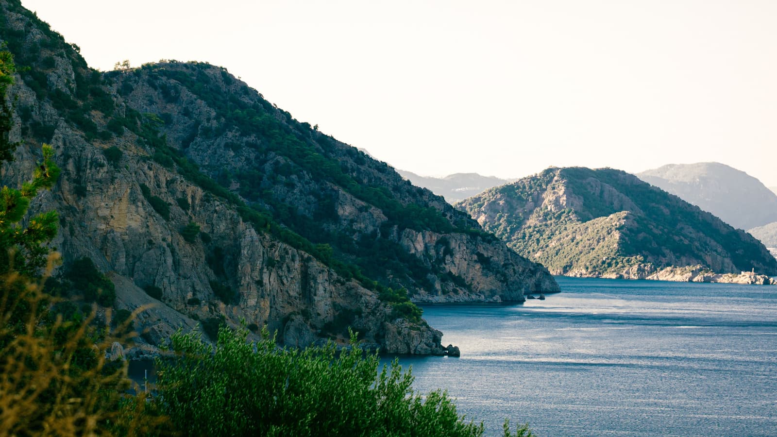 Marmaris marina with yachts and the pine-covered mountains of the bay in the background