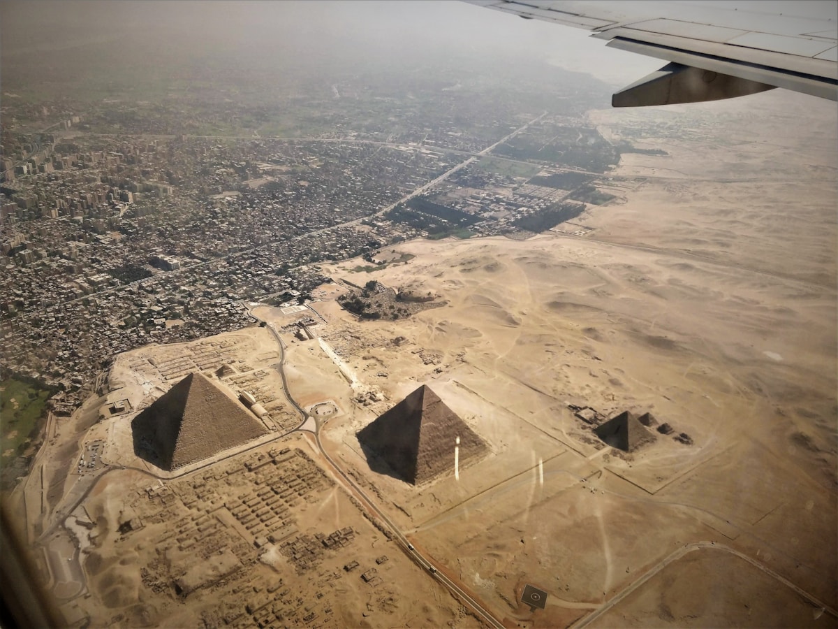 Aerial view of the three Great Pyramids of Giza from a plane window, Cairo, Egypt
