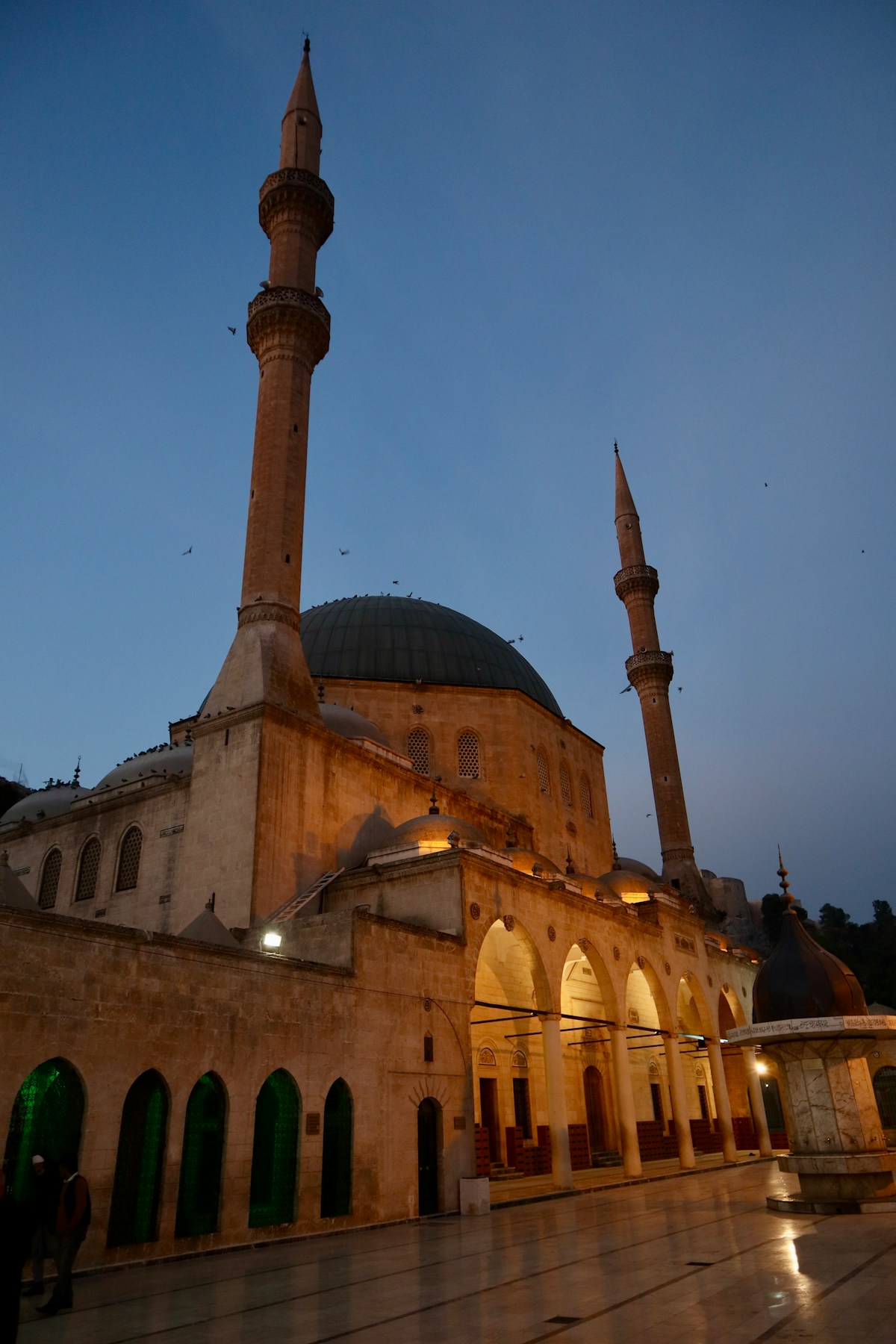 Mosque with two tall minarets at dusk - Şanlıurfa old city, southeastern Turkey