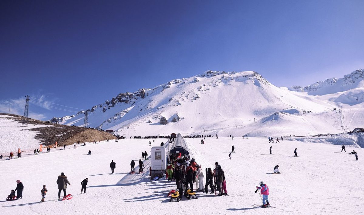 Skiers across snowy slopes at a Turkish ski resort