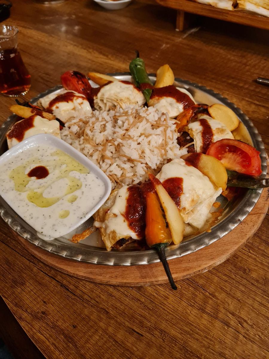 Turkish kebab plate served with rice and sides