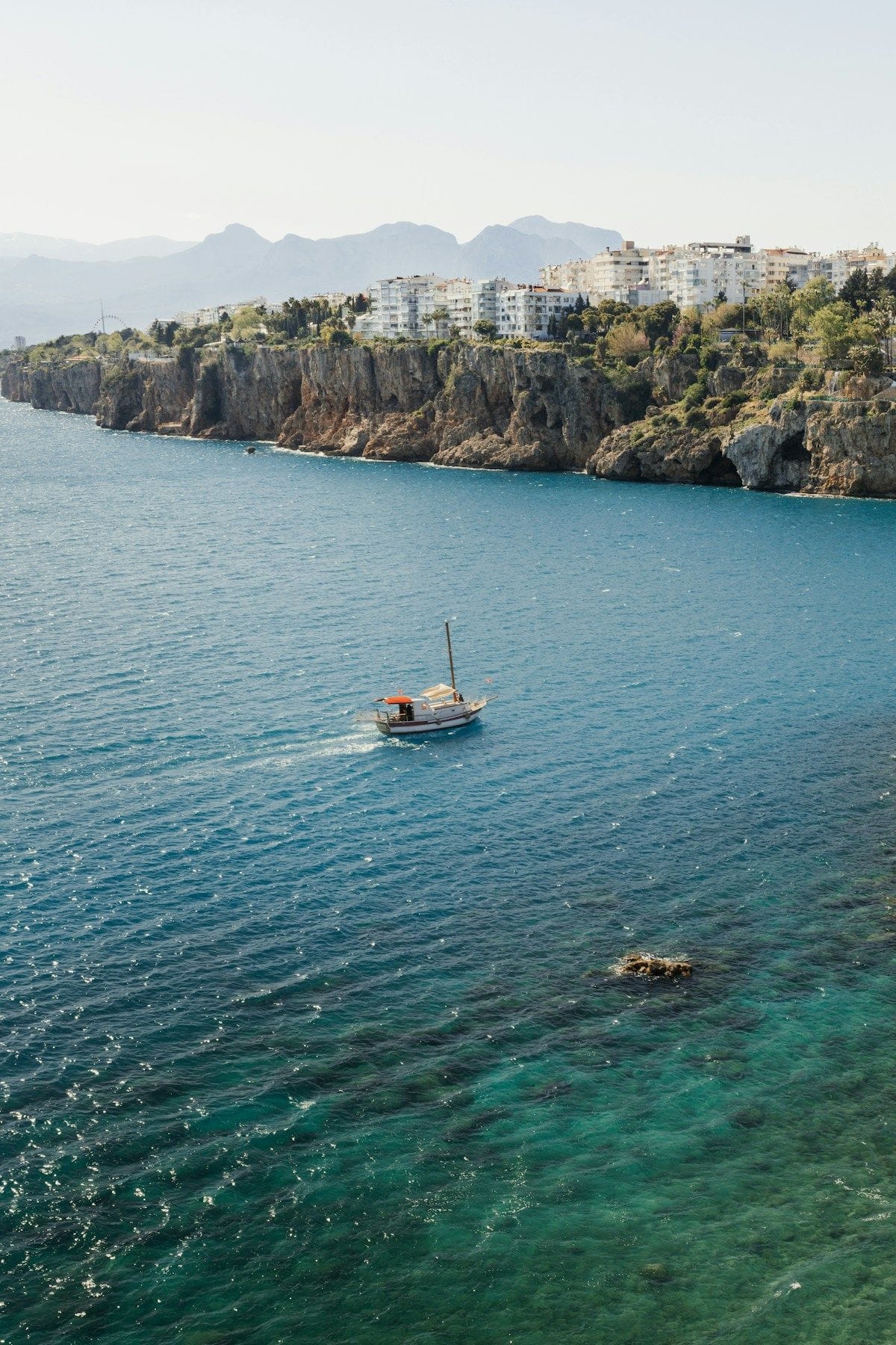 A traditional wooden gulet sailing on the azure waters of the Turkish Riviera near Antalya