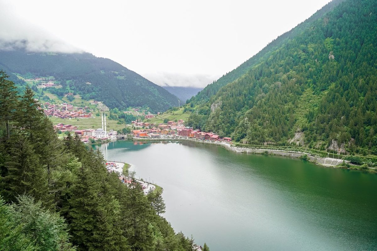 Aerial view of Uzungol Lake amid green hills