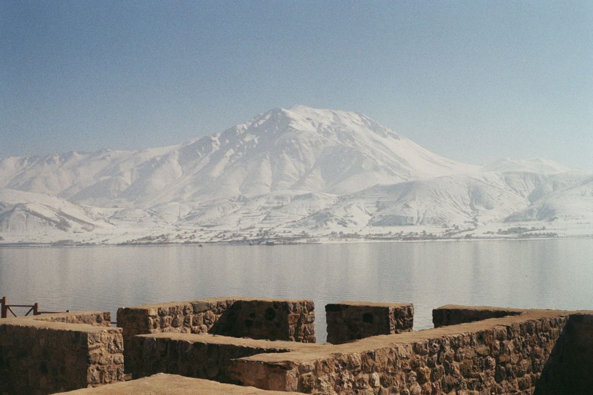 Snow-covered mountains and a calm lake near Van